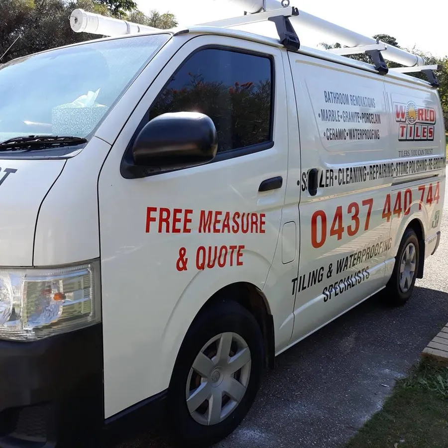 QLD World Tiles work van with 'Free measure and quote' and phone number 0437 440 744